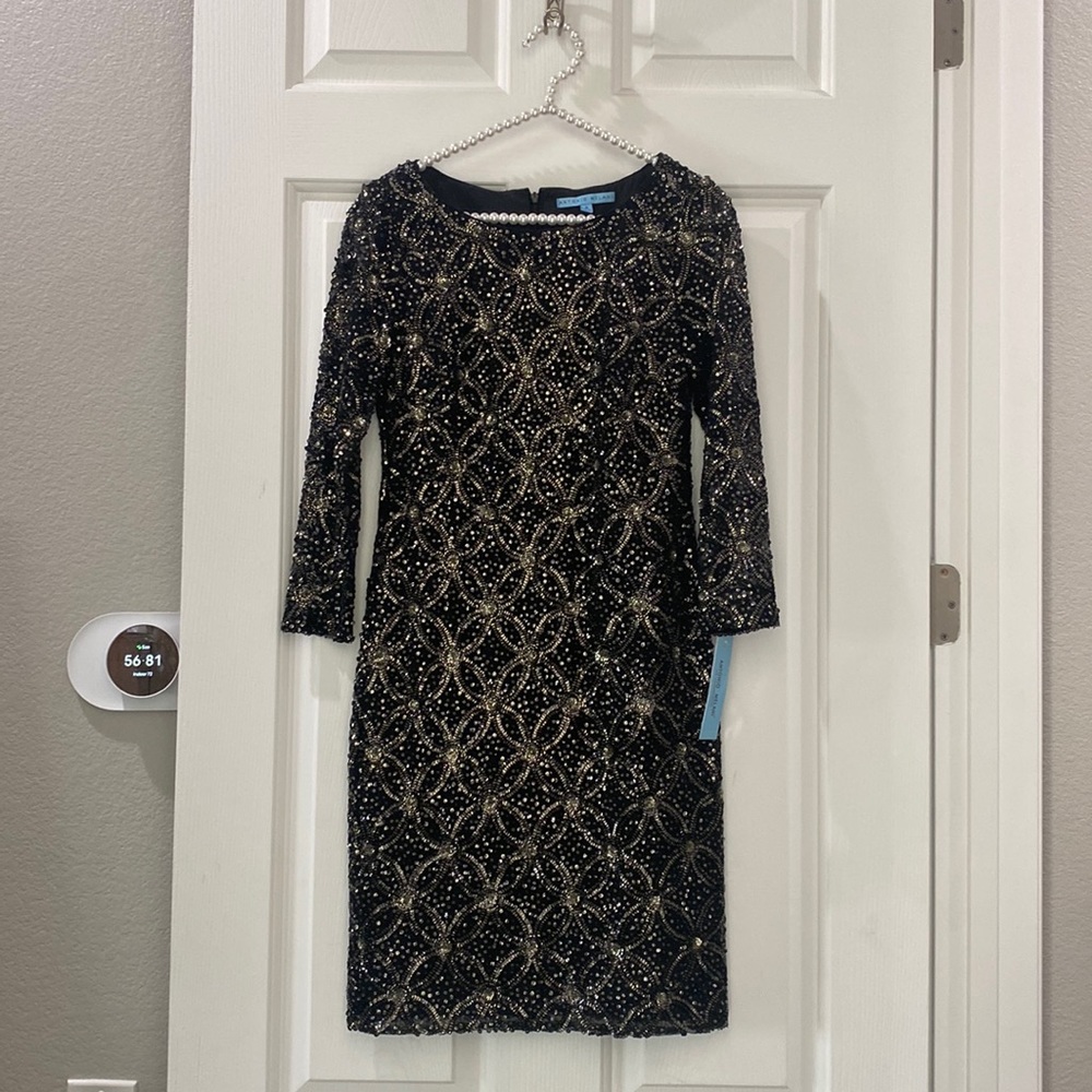 Long sleeve black and gold sequin dress